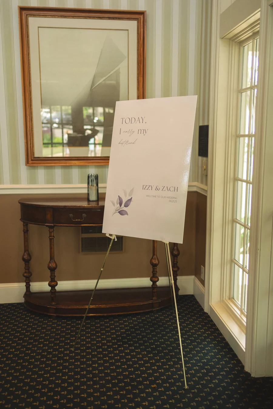 Welcome sign on an easel at the entrance of a wedding venue